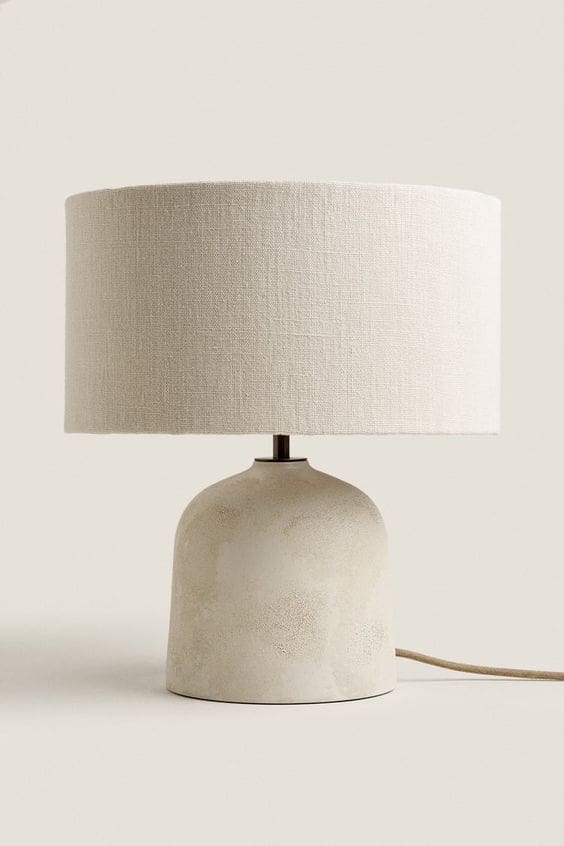 Image of micro-cement based bedside lamp with textured off-white shade