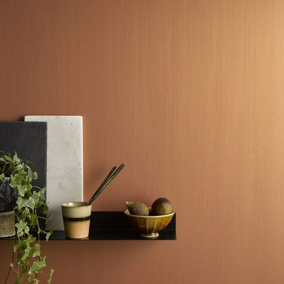 Metallic effect in warm copper finish to walls