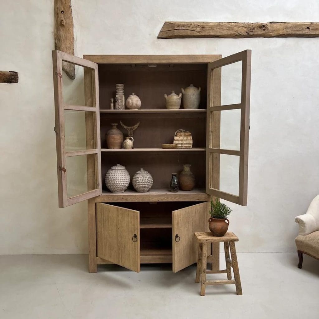 Rustic reclaimed tall oak unit with glazed glass front doors and shelving