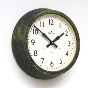 Vintage Smiths clock with white face and distressed copper casing