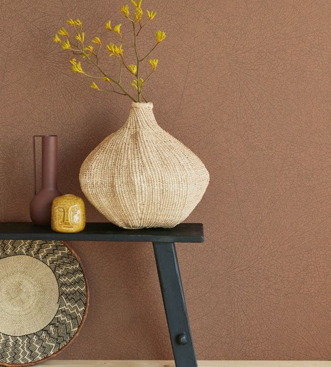 terracotta coloured wallpaper with leaf veining detail