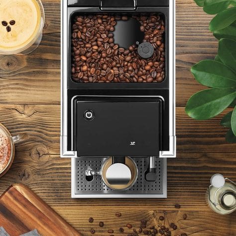 Overhead view of the Dualit Brew and Go coffee machine with beans ready to grind.