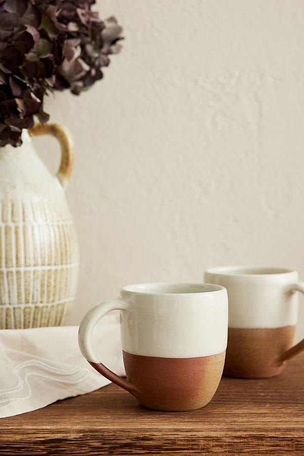 Pair of white glazed and terracotta bottomed cups 