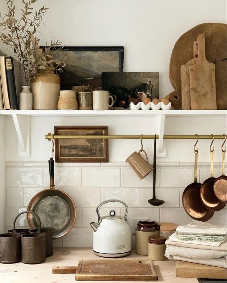 Vintage-inspired ceramic coffee storage with rustic wooden boards for decoration and white old-fashioned kettle