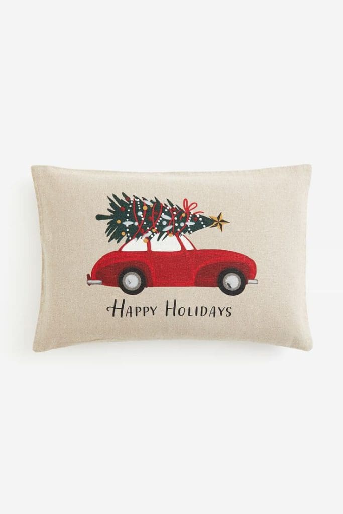 Beige linen cushion with red vintage car and Christmas tree on top design