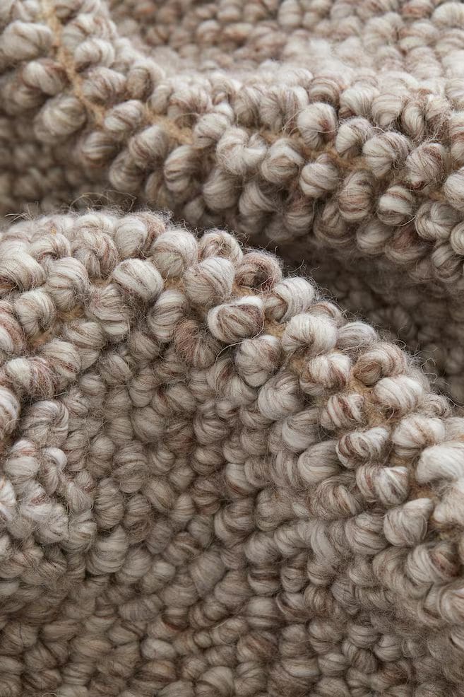 Knitted, woollen beige and brown throw