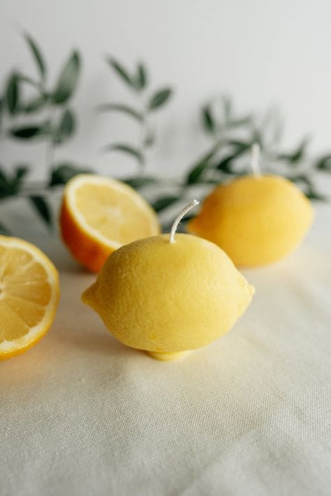 Soy candles that mimic the look shape and feel of real lemons