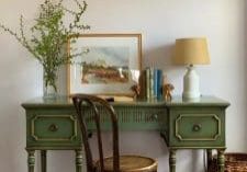 vintage furniture. green desk with dark wood cafe style chair.